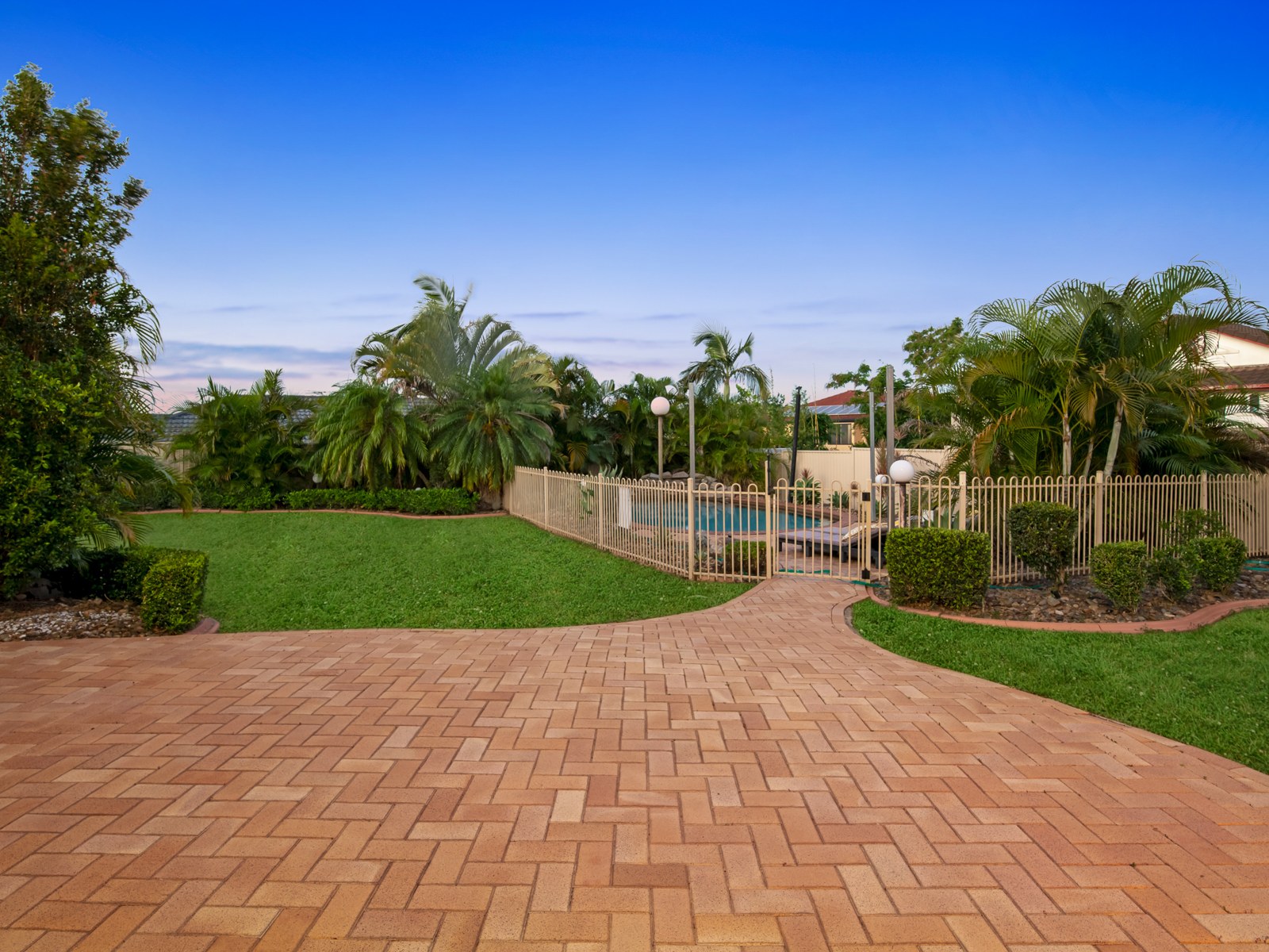 Paved courtyard leading to the pool