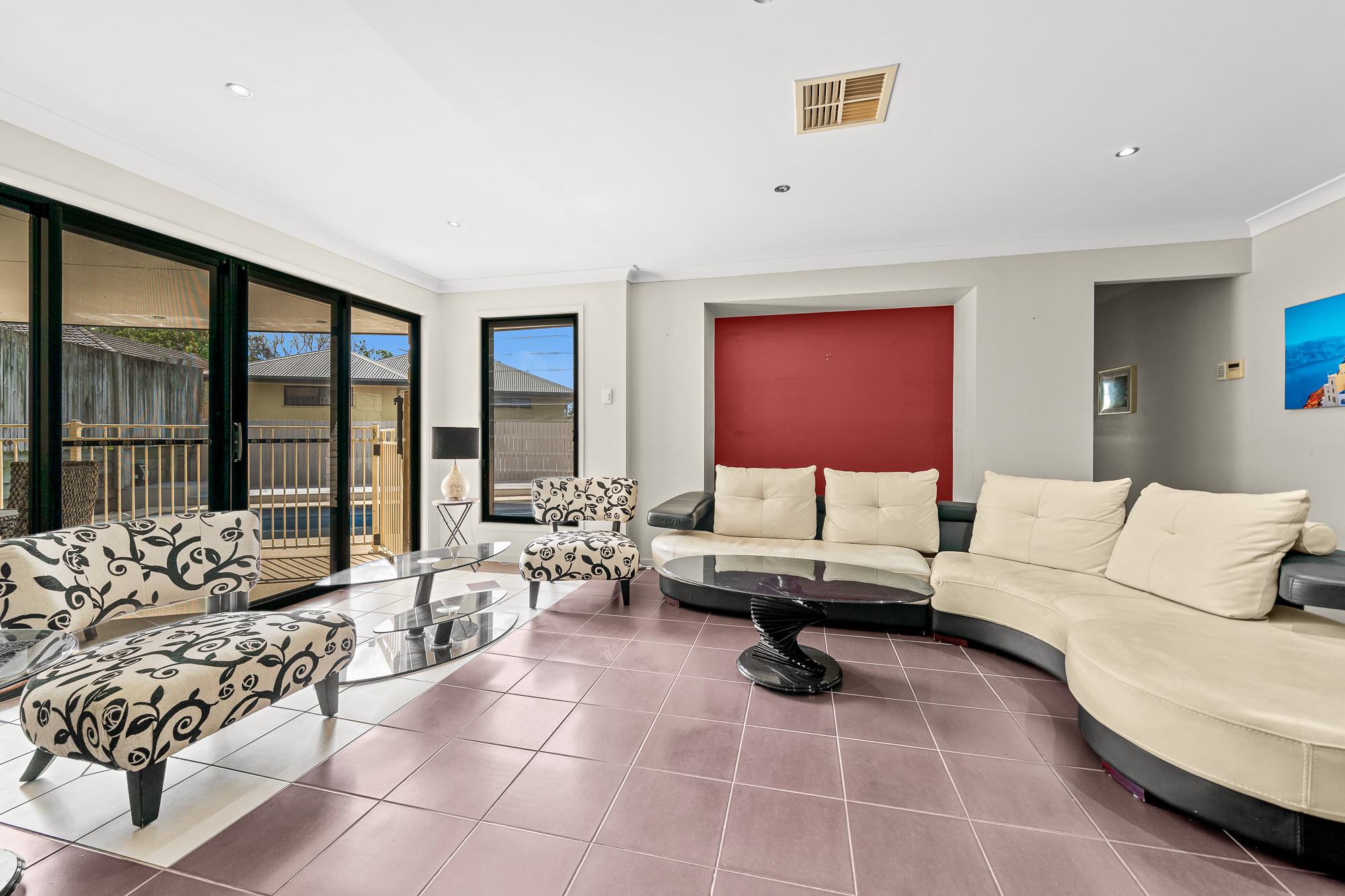 Lounge room at 25 Keith Street, Kuraby with view to the pool