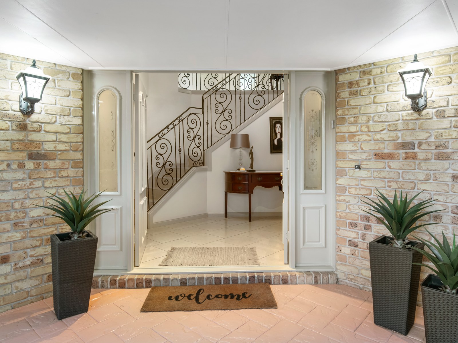 Double front doors under the entry portico