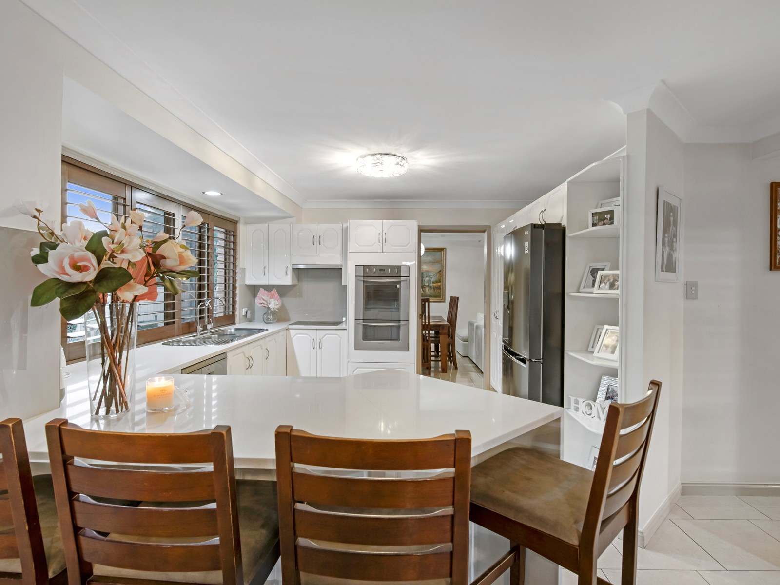 Kitchen with breakfast bar and double wall oven
