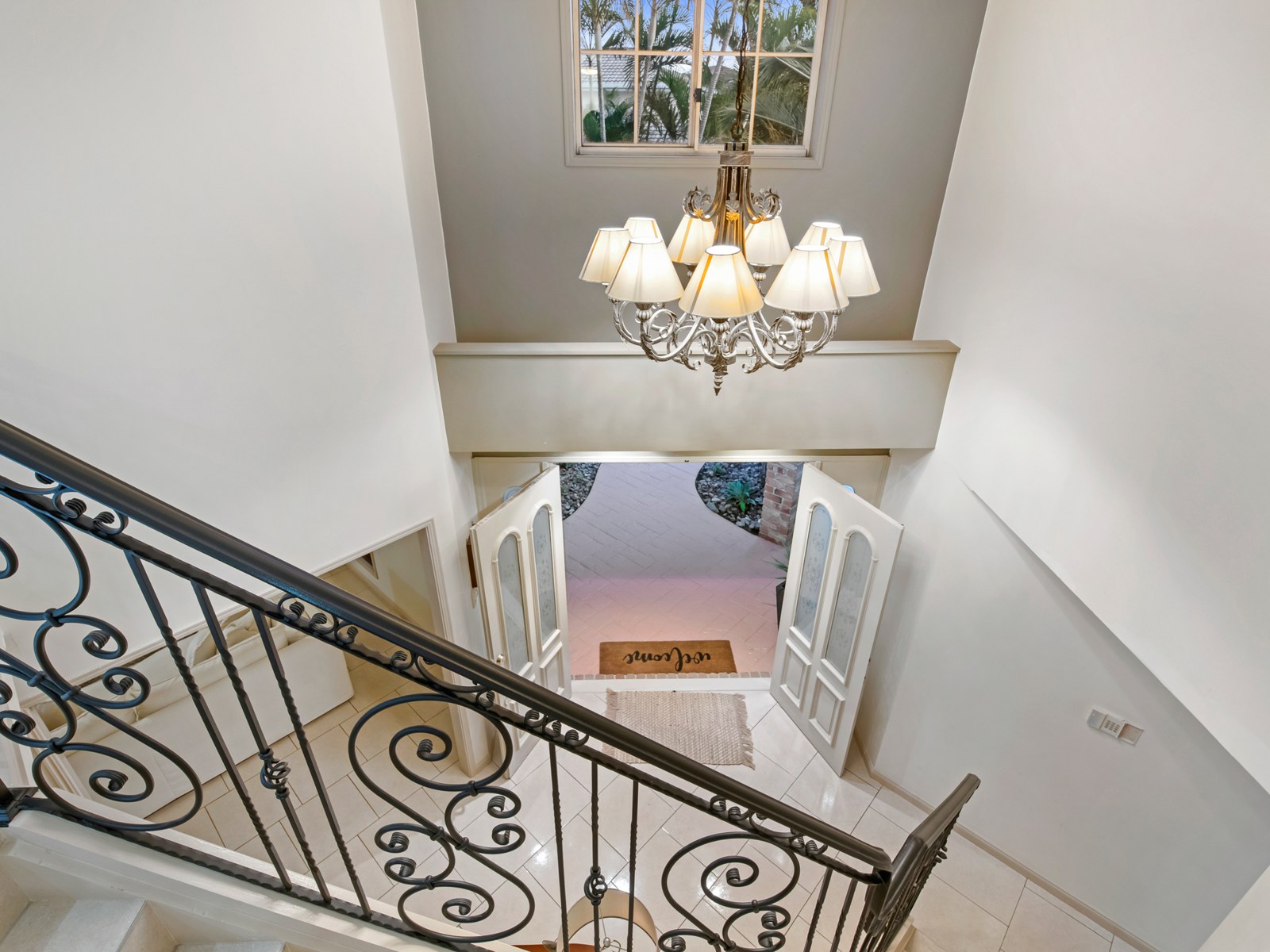 Double-height entry void with chandelier